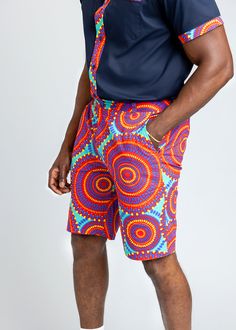 Style#M4004TRC Celebrate summer with our Debare Men's African Print Shorts in Turquoise Red Circles. "Debare," meaning "born during joyful times," perfectly encapsulates the essence of these shorts, designed in breathable all-cotton Ankara for peak summertime comfort. Explore matching outfits here. *Disclaimer* Please refer to the fabric image for the true color of this product. Features: 2 Pockets at Sides and Back 100% Cotton Ankara Fabric 10" inseam Designed in the USA, Imported Care Instruct African Print Shorts, Ankara Fabric, Print Shorts, Mens Fall, Workout Accessories, Printed Bags, Swimwear Accessories, Womens Fall, Matching Outfits