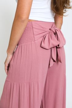 Step into summer with our Tie Waist Tiered Wide Leg Pant in Sunkiss Mauve. Designed for both style and comfort, these pants are the perfect addition to your warm-weather wardrobe. Key Features: Fabric Contents: Made from 100% Rayon, these pants offer a light and breathable fabric that keeps you cool during those hot summer days. Stylish Tie Waist: The tie waist feature not only enhances your silhouette but also allows for a customizable fit, ensuring you look chic while feeling comfortable. Wide Cute Preppy Outfits, Flowy Pants, Wide Leg Pant, Simple Trendy Outfits, Cute Everyday Outfits, Leg Design, Really Cute Outfits, Cute Simple Outfits, Summer Fashion Outfits