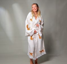 "Model Height : 5′ 2 (160cm) Stay trendy and comfortable with the Tiger Kaftan Kimono. Made from 100% organic cotton and hand-printed with the Tiger  design, this Greek goddess-style kaftan is the perfect cover-up for all your summer needs.  Whether you're spending the day at the beach, picnicing in the park, or just lounging at home, the lightweight, breathable fabric will keep you cool and comfortable. This eco-friendly and quick-drying kimono is an excellent choice for summer activities. Features *100% Cotton  *Soft, Light & Fluffy *An adjustable waist belt secures the robe from the front. Size: Length: 47\" - 120cm     Width: 33.5\" - 85 cm Care *Machine wash cold at a gentle cycle. *No bleach. *Iron on the reverse side Please do not hesitate to reach out to us with any questions. Than White Cotton Kimono For Fall, Cotton Kimono For Loungewear In Fall, Cotton Kimono With Printed Design And Relaxed Fit, Cotton Kimono For Fall Loungewear, Cotton Kimono With Relaxed Fit And Printed Design, Printed Cotton Kimono With Relaxed Fit, White Cotton Kimono With Relaxed Fit, Fall Beige Cotton Kimono, Beige Cotton Kimono With Relaxed Fit