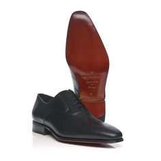 Free shipping Delivery from 5 to 10 business days Free returns. Exchanges up to 30 days Credit Card, Paypal and Multibanco (only for Portugal)  A 5-hole Oxford with an urban, contemporary silhouette.  Style: Oxford Exterior: Fine Calf Leather Lining: Leather Insole: Leather Outsole: Leather Option: Anti Slip Sole Material: Leather  Care intructions: Take good care of your shoes and they should do you proud for many years. Shoes should be put on using a shoe horn. Avoid wearing the same shoes on Business Leather Shoes With Perforated Almond Toe, Business Dress Shoes With Perforated Almond Toe, Business Oxfords With Perforated Plain Toe, Business Oxfords With Perforated Toe Box, Black Business Oxfords With Textured Sole, Modern Black Oxfords With Textured Sole, Business Casual Black Oxfords With Textured Sole, Business Casual Leather Shoes With Perforated Toe Box, Modern Plain Toe Oxfords For Business