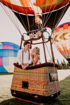 a man and woman in a hot air balloon