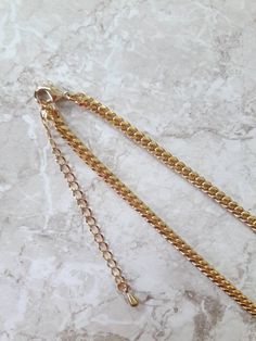 "Shiny 18K gold plated curb chain necklace ------------------- DETAIL ▪4mm 18K gold plated gold ( high quality chain made in Japan) ------------------- SIZE *This necklace is available in 3 lengths. 12\" - 15\" (12\" + adjustable 3 - inch extender) 15\" - 18\" (15\" + adjustable 3 - inch extender) 18\" - 21\" (18\" + adjustable 3 - inch extender) *It closes with lobster clasp. -------------------- JEWELRY CARE *Plated brass items are expected to tarnish over time, but to help the plating last lo Gold Cuban Link Necklace Minimalist Style, Gold Minimalist Cuban Link Necklace As Gift, Gold Cuban Link Double Chain Necklace, Gold Minimalist Cuban Link Necklace, Minimalist Gold Cuban Link Necklace, Formal Gold-tone Curb Chain Necklace, Minimalist Yellow Gold Chain Necklace, Tarnish Resistant, Yellow Gold Curb Chain Choker, 14k Gold-filled Chain Choker Necklace