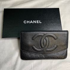 Chanel Cc Logo Caviar Long Bifold Wallet Good Used Condition. Missing Zipper Pull Inside Pocket. Has Indentation From Zipper / Zipper Pull Inside. Comes With Original Box/ Sticker And Dust Cover. No Card. Formal Pouch Clutch With Original Box, Textured Leather Clutch Wallet For Evening, Luxury Bifold Wallets With Removable Pouch, Luxury Bifold Wallet With Removable Pouch, Luxury Travel Clutch Wallet, Elegant Textured Leather Rectangular Wallet, Elegant Textured Leather Wallet, Luxury Bifold Clutch With Removable Pouch, Elegant Pouch Wallets With Original Box