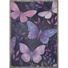 a purple and pink butterfly tapestry hanging on a wall