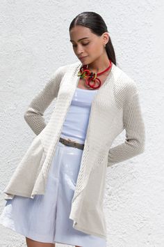 This 100% organic cotton cardigan boasts a classic ribbed texture that will add depth and sophistication to your outfit. Designed with versatility in mind, it features an open front for effortless layering. The long sleeves provide cozy coverage while maintaining sleek lines that complement your silhouette. Falling gracefully to mid-thigh, this piece offers both warmth and style without compromising on movement or ease. Open front Long ribbed texture sleeves Lightweight & Comfortable Hypoallerge Ribbed Cardigan For Fall Layering, Fall Ribbed Cardigan For Layering, Spring Cable Knit Cardigan For Everyday, Long Sleeve Ribbed Sweater Coat For Layering, Ribbed Long Sleeve Outerwear For Everyday, Everyday Long Sleeve Ribbed Outerwear, Everyday Ribbed Long Sleeve Outerwear, Versatile Sweater For Spring Layering, Versatile Spring Sweater For Layering