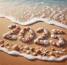 the word beach spelled out in seashells and starfish on a sandy beach