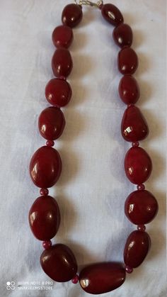 Supernatural 624 Ct Fine Quality Ruby Smooth oval Gemstone Necklace Stone : Ruby dyed Shape :- Smooth oval Necklace - 18 inch Size :- 16x22mm to 15x26mm Weight :- 624 carat Polish :- Handmade color - Red makes a great gift for your loved ones. Click below to see live stock: https://www.etsy.com/au/shop/ShakugemsStore?ref=search_shop_redirect If for any reason you are not satisfied with your purchase. You can return it for a full refund within 5 days (If you want maximum or minimum quantity of th Oval Necklace With Natural Stones For Formal Occasions, Classic Oval Handmade Necklaces, Red Gemstone Necklace With Oval Beads, Oval Bead Gemstone Necklace For Formal Events, Oval Gemstone Beads Necklace Perfect For Gifts, Formal Gemstone Necklace With Oval Beads, Formal Oval Bead Gemstone Necklace, Oval Natural Stone Beads For Gifts, Elegant Necklace With Large Oval Beads