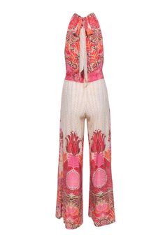 Get ready to slay on vacation with this Calypso jumpsuit in ivory, adorned with a playful pink and orange multicolored print. The unique mock neck tie detail adds a trendy touch to this already stylish jumpsuit. Complete the look with some wedges and a raffia crossbody bag! Size XS 95% Silk, 5% Spandex Mock neck tie closure Key hole back Smocked stretch waist Key hole front Bust 36" Waist 26" Shoulder to hem 60" Inseam 31" Pink Beachwear Jumpsuits And Rompers For Vacation, White Floral Print Jumpsuits And Rompers For Beach Season, White Floral Print Jumpsuits For Beach Season, Pink Bohemian Jumpsuits And Rompers For Vacation, Bohemian Pink Jumpsuit For Beach, White Printed Jumpsuits And Rompers For Beach, Bohemian Pink Jumpsuit For The Beach, Chic Cream Jumpsuits And Rompers For Vacation, Summer Cream Jumpsuits And Rompers For Beach