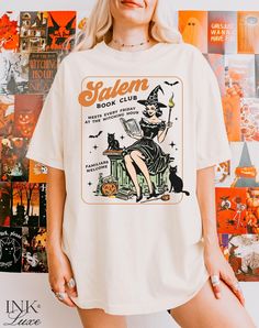 Salem Witches Book Club TShirt. We just love the retro vintage halloween illustrations. This tshirt is the perfect bookish gift for the spooky book lover! This design is also available on a sweatshirt: https://www.etsy.com/listing/1760445698/salem-book-club-sweatshirt-bookish **PLEASE NOTE** All shirts are printed to order, and personalized to the specifications you choose during checkout. Production time is 2-5 business days. ♥ DETAILS ♥ Comfort Colors tshirts have a unisex fit and are 100% rin Retro Halloween T-shirt With Character Print, Vintage Halloween T-shirt With Letter Print, Vintage Halloween Tops With Character Print, Vintage Halloween Character Print Top, Vintage Halloween Graphic Print Tops, Vintage Halloween T-shirt With Character Print, Vintage Cotton Halloween T-shirt, Vintage Halloween Cotton T-shirt, Salem Witches