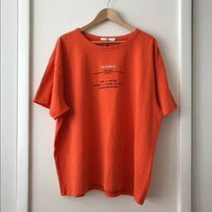 Oversized Men’s Tee Shirt. Super High Quality Tee Shirt From Great Brand. Very Oversized, Fits More Like A Medium Or Large. New With Original Tags, Never Been Worn. 100% Cotton. Reselling Because It’s Not The Best Color On Me. Short Sleeve Orange Top For Loungewear, Oversized Orange Crew Neck Top, Oversized Orange T-shirt For Streetwear, Oversized Orange Casual Tops, Oversized Crew Neck Shirt With Text Print, Oversized Casual Shirt With Text Print, Casual Drop Shoulder Top With Text Print, Trendy Oversized Orange T-shirt, Oversized Orange Tops For Streetwear