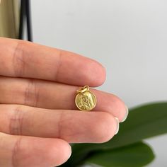 14KT yellow gold matte-finish Our Lady of Sorrows round medal pendant charm. Mini size Length: 15mm including bail Width: 10mm Weight: 1.03 grams Bail measures: 4.5mm x 3mm Stamped 14K Solid No chain included Coin Pendant Charms As Gift, Round Coin Pendant Charms As Gifts, Gold Round Pendant Charms That Are Tarnish Resistant, Coin Pendant Charms For Gifts, Tarnish Resistant Round Pendant Charms For Gifts, Gift Coin Pendant Charm, Symbolic Yellow Gold Charms With Round Pendant, Yellow Gold Moon Charm As Gift, Gold Coin Pendant Charms