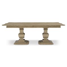 a wooden table with two pedestals on each side