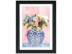 a blue and white vase filled with flowers on top of a pink wall next to a black frame