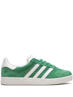 green suede/leather logo print to the side signature 3-Stripes logo contrasting heel counter round toe front lace-up fastening logo-debossed tongue branded insole rubber sole These styles are supplied by a premium sneaker marketplace. Stocking only the most sought-after footwear, they source and curate some of the most hard to find sneakers from around the world. Green Adidas Lace-up Skate Shoes, Low-top Suede Adidas Sneakers, Adidas Logo Low-top Suede Sneakers, Green Low-top Adidas Skate Shoes, Adidas Green Skate Shoes With Three Stripes, Adidas Green Skate Shoes With Logo, Green Adidas Skate Shoes With Logo, Green Skate Shoes With Three Stripes And Round Toe, Classic Green Adidas Sneakers