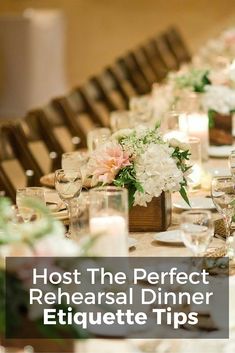 a long table is set with white and pink flowers