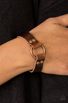 Shiny strips of brown leather loop around a shimmery copper hoop, creating an urban centerpiece. Features an adjustable snap closure. Sold as one individual bracelet. P9UR-CPXX-022XX Luxury Leather Bracelet With Waxed Finish, Luxury Leather Bracelets With Brass Hardware, Cheap Trendy Leather Bracelet For Parties, Luxury Waxed Leather Bracelet, Cheap Casual Brown Leather Bracelet, Stamped Leather Bracelets, Leather Cord Bracelets Women, 1mm Leather Cord Bracelet, Leather Wristbands Wrap