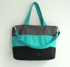 *** Please check 'shop announcement' for production time and delivery before your purchase. ***This bag is made from teal, grey and black water-resistant nylon, a sturdy and durable material. It is very roomy and big enough to hold lots of your essentials. You can use it as a everyday bag, school bag, laptop bag (please check dimensions), messenger bag or diaper bag.If you prefer this style in different colors, you can see color samples from my other  listings : http://www.etsy.com/shop/tippytha Green Rectangular Diaper Bag For On-the-go, Green Large Capacity Shoulder Bag For Trip, Green Shoulder Bag For Trip With Large Capacity, Green Shoulder Bag With Large Capacity For Trips, Rectangular Green Diaper Bag For Everyday Use, Green Tote Diaper Bag For Everyday Use, Green Tote Diaper Bag For Daily Use, Green Tote Travel Bag For Trips, Everyday Green Tote Diaper Bag