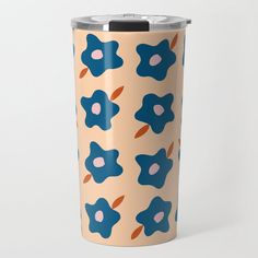 a blue and orange flower pattern on a tan colored tumbler cup with black lid