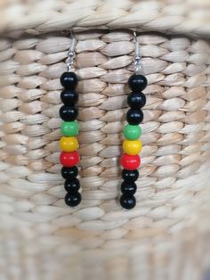 "Long drop earrings with black, red, yellow and green wooden beads, full length 3\", drop length 2.5 \", ideal for every occasion" Jamaican Beaded Jewelry, Wooden Beads Earrings, Multicolor Dangle Beaded Earrings With Wooden Beads, Casual Black Dangle Jewelry, Multicolor Wooden Beaded Earrings As A Gift, Multicolor Wooden Beads Dangle Earrings, Multicolor Wooden Beads Round Earrings, Handmade Black Casual Earrings, Multicolor Wooden Beaded Earrings