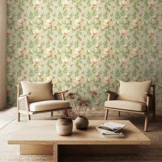 two chairs and a coffee table in front of a wallpapered room with flowers