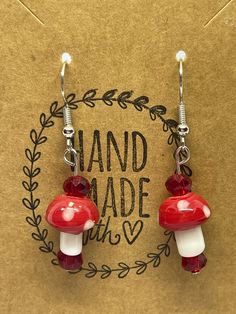 "Title: \"Glass Mushroom Bead Earrings - Whimsical Forest Delight for Your Ears!\" Description: Step into a world of enchantment with our Glass Mushroom Bead Earrings, a whimsical tribute to the magic of the forest. Each pair of these earrings is a tiny masterpiece, handcrafted with care to capture the charm and wonder of mushrooms found deep in the woods. 🍄 **Forest Magic These earrings are a nod to the mystical allure of the forest, where mushrooms symbolize growth, renewal, and a connection to nature. They are perfect for those who appreciate the beauty of the outdoors. 🌿 **Handcrafted Elegance Crafted with attention to detail, these earrings feature delicate glass mushroom beads that are as intricate as the real thing. Their lifelike appearance adds a touch of artistry and charm to y Whimsical Mushroom-shaped Earrings For Gifts, Whimsical Beaded Earrings As A Gift, Whimsical Beaded Earrings For Pierced Ears, Whimsical Beaded Earrings For Pierced Ears As A Gift, Adjustable Mushroom Design Earrings As Gift, Whimsical Beaded Drop Earrings, Whimsical Adjustable Beaded Dangle Earrings, Cottage Core Mushroom, Video Game Jewelry