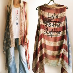 "Vintage looking American Flag, Red White and Blue \"Livin' to the Rhythm\" semi sheer vest- A perfect accessory for the 4th of July, music festivals or anytime, it always looks great.  Super lightweight, semi sheer perfect for hot summer days or nights. Can be ordered with or without \"Livin' to the Rhythm\" choose in drop down when checking out. One size fits most Because the arm holes are larger and the front stays open it does work great for a wide variety of sizes and body types.   Approx. Spring Concert Sleeveless Vest, Sleeveless Vest For Spring Concert, Fall Festival Sleeveless Tank Top, Beach Vest Tops For Fall, Red Flag Print Tank Top For Summer, Red Tank Top With Flag Print For Summer, 4th Of July Sleeveless Flag Print Top, Red Patriotic Top For Fall, Patriotic Sleeveless Tops For Spring