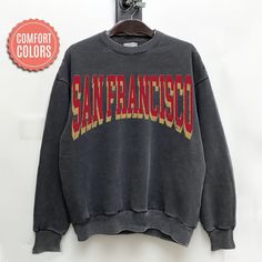 "comfort colors San Francisco Football sweatshirt, San Francisco Football Shirt, San Francisco Football Gift -Please check Color and Size Charts before placing the order. You can find them in the listing's photos (Depending on what device you are viewing this listing colors may vary slightly). -Returns and exchanges are accepted only if there are defects \"No Extra Costs\" We create custom t-shirts with great designs for everyone's liking. If you don't find the size or color you would like, please message us and we will be happy to  accommodate! comfort colors San Francisco Football sweatshirt, San Francisco Football Shirt, San Francisco Football Gift PRODUCT Sweatshirt Comfort Colors® 1566     80% ring-spun cotton, 20% polyester     Medium-heavy fabric (9.5 oz /yd² (322.1 g/m     Relaxed Casual Soft-washed Sweatshirt For College, Collegiate Sweatshirt With Screen Print, Relaxed Fit, Oversized Comfortable Sweatshirt With Letter Print, Oversized Casual Sweatshirt, College Crew Neck Soft-washed Sweatshirt, College Relaxed Fit Soft-washed Sweatshirt, College Soft-washed Relaxed Fit Sweatshirt, Soft-washed Crew Neck Sweatshirt For College, Oversized Pre-shrunk Sweatshirt For Streetwear