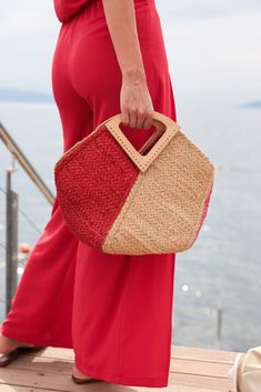 Stand out from the crowd this summer with Shiraleah's Jazz Mini Tote. This classic woven jute bag features a chic triangular top handle and both pink and red design for an extra pop of color. Pair with other items from Shiraleah to complete your look! Features a top handle and trendy multicolor design Shiraleah is a trend-driven lifestyle brand focused on the little gifts that make life special! Made from jute Measures L 16" x w 8" x h 12" Made in india Chic Summer Crochet Bag With Top Handle, Chic Summer Crochet Top Handle Bag, Chic Crochet Bag With Top Handle For Summer, Chic Crochet Top Handle Bag For Summer, Chic Red Beach Bag, Summer Top Handle Crochet Shopping Bag, Red Beach Bag For Spring, Spring Top Handle Straw Bag For Day Out, Chic Red Beach Bags