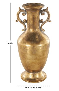 a large gold vase sitting on top of a table