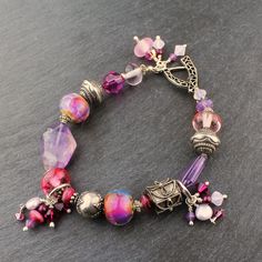 Lampwork Bracelet Sterling Silver, Purple Amethyst, Pink, Beaded Jewelry Bohemian Silver Faceted Beaded Bracelets, Spiritual Faceted Beads Crystal Bracelet For Jewelry Making, Amethyst Beaded Bracelets With Spacer Beads As Gift, Handmade Purple Sterling Silver Beaded Bracelets, Bohemian Faceted Crystal Bracelet With Round Beads, Bohemian Silver Crystal Bracelet With Polished Beads, Silver Amethyst Beaded Bracelets, Purple Sterling Silver Beaded Bracelets With Round Beads, Silver Crystal Bracelet With Amethyst Beads