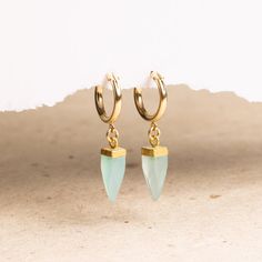 Aqua Chalcedony Pendulum Gemstone Spikes on 15k Gold Filled Huggie style earring - Minimalist, Elegant, Handmade jewelry gifts for her, wife Gemstone: Genuine Aqua Chalcedony Gemstones: 19x5mm approximately Bezel: Vermeil Gold (14k Gold over Sterling Silver) Hoops Material: 14K Gold Filled Hoop Diameter: 13mm Hoop Width: 2mm Closure: FlexCatch Note that due to the handmade nature of these genuine stones, measurements are approximately and might vary slightly for each stone. Arrives in giftbox... Earring Minimalist, Store Jewelry, Gold Filled Hoops, Writing Gifts, Aqua Chalcedony, Handmade Jewelry Gift, Sterling Silver Hoops, Agate Pendant, Jewelry Earrings Hoops