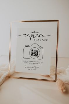 a photo frame with the caption capture the love written in black ink on it