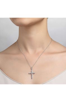 Six glittering simulated diamonds add dazzling dimension to this hand-polished cross-pendant necklace that makes a treasured keepsake. 20" length; 5/8"W x 7/8"L pendant Total simulated-diamond weight: 2.76ct. Sterling silver bonded with platinum/simulated diamond Imported Silver Diamond Cross Pendant Jewelry, Crystal Cross Pendant Clavicle Necklace, Crystal Clavicle Chain With Cross Shape, Crystal Cross Clavicle Chain Jewelry, Crystal Cross Clavicle Chain, Silver Brilliant Cut Cross Pendant Jewelry, Elegant Pendant Cross Necklace With Clavicle Chain, Elegant Cross Pendant Necklace With Clavicle Chain, Elegant Clavicle Chain Jewelry With Cross Pendant