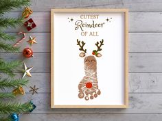 a framed christmas card with the words cutest reindeer of all