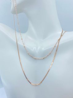 Solid 10K White Gold Rope Chain. This classic Rose Gold Gold Necklace is a must have in your jewelry collection. Makes an amazing Christmas gift for anyone. Layer perfectly with other necklaces. Premium Lobster Hook for added safety! Details: * Material: 10K Rose Gold * Pattern: Rope, Flat Mariner, Ball Station * Length: 16in, 18in 20in Rope Chain Width: 2mm Ball Chain Width: 1.8mm(ball) 1mm(Chain) Mariner : 1.3mm Arrives in a GIFT BOX and includes FREE SHIPPING within the USA. International Shi Classic Rose Gold Chain Necklace With Delicate Chain, Classic Rose Gold Delicate Chain Necklace, Classic Delicate Rose Gold Chain Necklace, Elegant Rose Gold Double Chain Necklace, Rose Gold Clavicle Chain Jewelry In 14k Gold, Rose Gold 14k Clavicle Chain Jewelry, Classic Rose Gold Jewelry With Adjustable Chain, Rose Gold Tarnish Resistant Chain Necklace For Anniversary, Formal Rose Gold Chain Jewelry