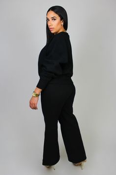 Elevate your cozy looks with our Chic Comfort sweatsuit. This sweatsuit has a relaxed fit dropped-shoulder pullover sweater, with wide leg bottoms. The bottoms have real pockets, and an elastic waistband with an adjustable drawstring. This upscale sweatsuit is versatile enough to wear with heels for a dressier look, or sneakers for a more casual dressed-down vibe. This sweatsuit is lined with fleece, keeping you not only cute - but cozy too! Material: 80% Cotton, 20% PolyesterStretch: Does have Black Sweater For Loungewear, Oversized Sweats With Elastic Waistband For Fall, Fall Long Sleeve Sweats With Elastic Waistband, Black Pants With Elastic Cuffs For Fall, Oversized Pants With Elastic Cuffs For Fall, Oversized Solid Tracksuit For Fall, Oversized Fall Tracksuit In Solid Color, Oversized Solid Color Tracksuit For Fall, Black Sweatpants For Lounging In Fall