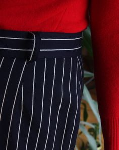 Beautiful vintage skirt made of pure wool. Long, midi high waisted cut. Navy blue color with pattern of white pinstripes. Zipper and button closure, belt loops. Row of buttons on the front. Lined. Era: 80's, Italy Fabric: 100% wool Condition: perfect, looks unworn Estimated size: L / XL (please, check the measurements) Measurements (measured flat): Waist: 42 cm / 16,5 inches Length: 68 cm / 26,7 inches Red turtleneck sweater available here: https://www.etsy.com/listing/214804600/80s-italian-red- Navy Pleated Skirt For Workwear, Navy Pleated Skirt Bottoms For Workwear, Striped Midi Skirt For Work, Striped Lined Skirt For Workwear, Striped Fitted Midi Skirt, Striped Lined Skirt Bottoms For Workwear, Pinstripe Vertical Stripes Skirt For Work, Retro Workwear Lined Skirt, Vintage Striped Bottoms For Workwear