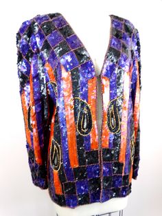 "This is a stunning statement piece! This evening jacket is fully embellished with sequins all over in a retro design. It's in excellent condition! Bust - 40\" (there is 1 hook closure) Shoulders - 16\" Sleeves - 24\" Top to Bottom - 27\" All of my items come from a smoke-free and pet-free home. If you have any questions, please don't hesitate to ask!" Festive Sequined Evening Outerwear, Festive Evening Outerwear With Sequins, Long Sleeve Embellished Outerwear For Party, Glamorous Beaded Party Outerwear, Fall Embellished Fitted Sequin Fabric, Embellished Sequin Fabric For Fall Fitted Outfits, Fall Embellished Sequin Fabric In Fitted Style, Vintage Festive Sequin Outerwear, Vintage Sequined Outerwear For Festive Season