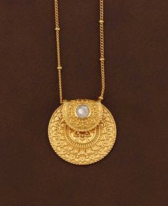 Step into a realm of serene beauty with our Inspirational Gold Plated Mandala Necklace, now adorned with a mesmerizing Rainbow Moonstone. This necklace is not just a piece of jewelry; it's a beacon of tranquility and equilibrium. Design and Material: Gold-plated over brass, featuring a 16+3 inch adjustable chain with lobster clasp. The pendant measures 1" wide Rainbow Moonstone Symbolism: Represents inner clarity, cyclical change, and the balancing of emotions Inspirational Inscription: 'Peace & Moon Phase Round Pendant Necklace For Wedding, Elegant Jewelry With Moon Charm For Meditation, Wedding Necklaces With Moon Phase Round Pendant, Elegant Healing Medallion Jewelry, Fusion Style Ritual Gemstone Necklace, Moon Phase Medallion Necklace In Amulet Style, Moon Phase Medallion Necklaces Styled As Amulets, Bohemian Coin Pendant Jewelry For Meditation, Spiritual Moon Phase Round Pendant Necklace