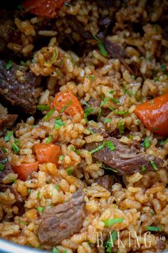 a pot filled with rice and vegetables on top of a table