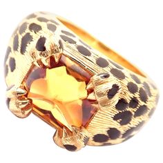 18k Yellow Gold Leopard Citrine & Enamel Ring by Christian Dior. This absolutely gorgeous ring comes with an original Dior certificate of authenticity. With One Large Citrine Stone: 10mm x 10mm. Details: Size: European 51, US 5 3/4 Width at Top: 12mm Weight: 17.5 grams Stamped Hallmarks: Dior 750 B3112 51 *Free Shipping within the United States* YOUR PRICE: $8,500 T2776ttad Victoire De Castellane, Vintage Designer Jewelry, David Webb, Dior Jewelry, Colored Stones, Citrine Stone, John Hardy, 18k Yellow Gold Ring, Enamel Ring