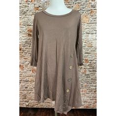 Solid Mocha Color 3/4 Sleeve Top In A Relaxed Fit With A Round Neckline, Button Trim And Asymmetrical Hem. Great Casual Top For Everyday Wear, Lots Of Stretch, Lightweight, Nice Fall Color 95% Rayon 5% Spandex For Search Purposes Only: Boutique Comfy Clothes Fall Clothes Winter Clothes Fall Top Mom Style Women Clothes Women's Fashion Women's Top Boutique Fashion Casual Style Brown Tunic Brown Top Casual Asymmetrical Top With Button Closure, Spring Tops With Asymmetrical Hem And Buttons, Spring Tops With Buttons And Asymmetrical Hem, Casual Tops With Button Closure And Asymmetrical Hem, Spring Top With Asymmetrical Hem And Button Closure, Casual Fall Tunic With Buttons, Long Black Shirt, Brown Tunic, Bohemian Tunics