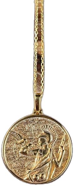 a gold medal with an image of jesus on the front and back side, hanging from a chain