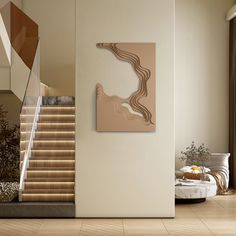 a living room filled with furniture and a painting on the wall next to a stair case