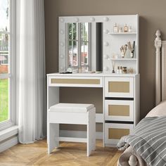 a bedroom with a bed, dresser and dressing table in the corner next to a window