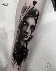 a woman's face is shown on the arm with black and white inks