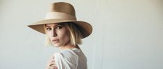 JANESSA LEONE - Sand Packable Straw Fedora - Clemence Luxury Summer Hat With Curved Brim, Luxury Brimmed Summer Hats, Modern Everyday Hats For Spring, Modern Everyday Spring Hats, Flat Brim Panama Hat For Everyday Spring Wear, Luxury Brimmed Boater Hat For Summer, Luxury Wide Brim Boater Hat For Summer, Everyday Flat Brim Panama Hat For Spring, Everyday Panama Hat With Flat Brim For Spring