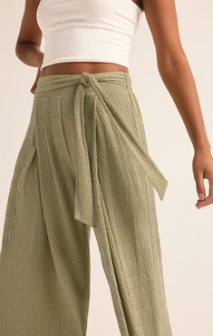 Take your casual look to the next level with the elevated, wide leg Isla Pucker Knit Pant. This pull on style features flattering details that will make this a pant you reach for on repeat. Chic Cotton Wide Leg Pants With Pull-on Style, Trendy Solid Bottoms With Tie Waist, Relaxed High Waist Spring Pants, Chic Loungewear Pants With Tie Waist, Relaxed High Waist Pants For Spring, Casual Wide Leg Pants With Tie Waist, Spring Solid Wide Leg Pants With Tie Waist, Relaxed High Waist Wide Leg Pants For Spring, Relaxed Wide Leg Pants With Pull-on Style For Spring