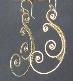 "Hammered wired swirls, about 3\". Available in 14k gold filled & sterling silver, 14k rose gold filled **We now offer LAYAWAY**Please read our policy section for more info - http://www.etsy.com/shop/CalicoJunoJewelry/policy" Unique Gold Wire Jewelry, Elegant Swirl Wire Wrapped Earrings, Gold Sterling Silver Jewelry With Modern Twist, Gold Freeform Wire-wrapped Jewelry, Gold Wire Wrapped Freeform Jewelry, Elegant Wire Wrapped Copper Wire Jewelry, Gold Freeform Wire Wrapped Jewelry, Elegant Spiral Wire Wrapped Jewelry, Elegant Spiral Filigree Jewelry