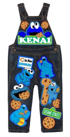 a pair of children's overalls with sesame and cookie characters on them